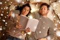 Happy couple reading book at home Royalty Free Stock Photo