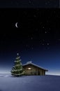 Christmas Illuminated hut in cold winternight