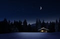 Christmas Illuminated hut in cold winternight