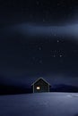 Christmas Illuminated hut in cold winternight