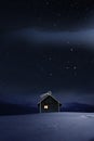 Christmas Illuminated hut in cold winternight