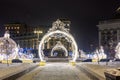 Christmas illumination figures on the street of the city. The snowstorm. Royalty Free Stock Photo