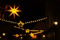 Christmas illumination.Shining garlands of European Christmas streets. winter holidays in Germany.Dark with shimmering Royalty Free Stock Photo