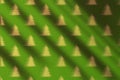 Green wall texture with Christmas trees as pattern and moody shadow. Royalty Free Stock Photo