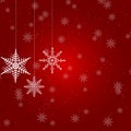 Christmas illustration with several hanging snowflakes on red background