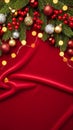 Elegant red fabric Christmas background with pine branches, red berries and festive ribbon ornaments Royalty Free Stock Photo