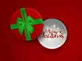 Christmas inscription in the open red gift box with green ribbon and bow isolated on red background. Top view. Template Royalty Free Stock Photo