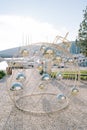 Christmas installation in the form of a Christmas ball with garlands stands on the pier