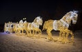 Christmas installation in the Museum-reserve `Tsaritsyno`. A fairy-tale luminous carriage drawn by six luminous horses. Moscow,