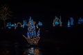 Christmas installations from garlands.shining ship made of garlands in the dark. Royalty Free Stock Photo