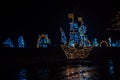 Christmas installations from garlands.shining ship made of garlands in the dark.Shimmering street scenery on night Royalty Free Stock Photo