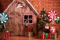 Christmas interior with wooden house, candy, tree and gifts. No people. Holiday background Royalty Free Stock Photo