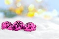 Christmas jingle bells on snowy background and defocused lights Royalty Free Stock Photo