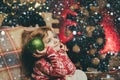 Christmas kids mood. Cute angel of Christmas with shining balls. The child looks up dreamily. Waiting for Christmas Royalty Free Stock Photo