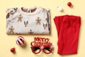 Christmas kids outfit. Toddlers pajama set on color background. Baby fashion holiday wear