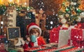 Christmas kids in snow. Boy child with laptop near christmas tree. Buy christmas gifts online. Christmas shopping