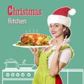 Christmas kitchen.Smiling woman holding roasted chicken