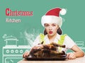 Christmas kitchen.Young woman overlooked roast chicken in her kitchen