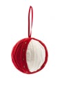 Christmas knitted ball hanging on red ribbon
