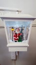Christmas lamp with decorations inside of a Santa decorations