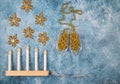 Christmas lamp in the form of candles, decorations-snowflakes on a blue background.