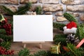 Christmas landscape card mockup template with fir twigs and Christmas decoration on wooden background Royalty Free Stock Photo