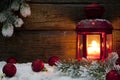 Christmas lantern with baubles on snow