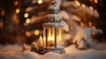 Christmas lantern with burning candle on blurred winter background with falling snow Royalty Free Stock Photo
