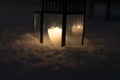 Christmas Lantern with burning candle on Snow Evening Scene Royalty Free Stock Photo