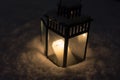 Christmas Lantern with burning candle on Snow Evening Scene Royalty Free Stock Photo