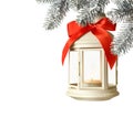 Christmas lantern with candle hanging on snowy fir tree branch against light background. Space for text Royalty Free Stock Photo