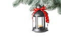 Christmas lantern with candle hanging on snowy fir tree branch against light background. Space for text Royalty Free Stock Photo
