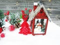 Christmas lantern decoration winter berries and snow on wooden b Royalty Free Stock Photo