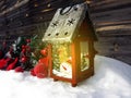 Christmas lantern decoration winter berries and snow on wooden b Royalty Free Stock Photo