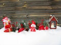 Christmas lantern decoration winter berries and snow on wooden b Royalty Free Stock Photo