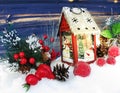 Christmas lantern decoration winter berries and snow on wooden b Royalty Free Stock Photo