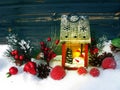 Christmas lantern decoration winter berries and snow on wooden b Royalty Free Stock Photo