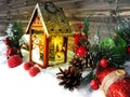 Christmas lantern decoration winter berries and snow on wooden b Royalty Free Stock Photo