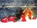 Christmas lantern decoration winter berries and snow on wooden Royalty Free Stock Photo