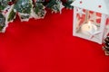 Christmas Lantern and Holly Branch on Red Background Royalty Free Stock Photo