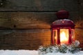 Christmas lantern light in night on snow