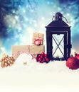 Christmas lantern with ornaments in the snow Royalty Free Stock Photo