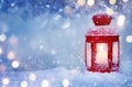 Christmas lantern on snow with frosen fir branch in light Royalty Free Stock Photo