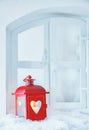 Christmas lantern on a snowy windowsill Royalty Free Stock Photo