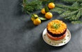 Christmas layered vegetable salad with herring and boiled vegetables