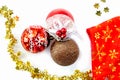 Christmas layout: christmas balls, gold tinsel, stars, santa hat on a white background Royalty Free Stock Photo