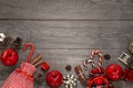 Christmas layout. Fresh red apples, cinnamon sticks, anise stars, candies and Christmas decor on old wooden background with copy s Royalty Free Stock Photo