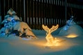 Christmas LED decoration deer. Courtyard of house. Too much snow. lights trees