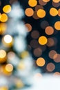 Christmas light background. Holiday glowing backdrop. Defocused background with blurred bokeh Royalty Free Stock Photo