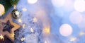 Christmas Light background. Xmas tree with snow decorated with garland star lights, holiday festive backdround. Royalty Free Stock Photo